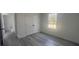 Cozy bedroom featuring luxury vinyl flooring, a window for natural light, and a closet at 245 Marion Oaks Golf Rd, Ocala, FL 34473