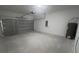 Spacious garage with ample room for parking and storage; includes water heater and electrical panel at 245 Marion Oaks Golf Rd, Ocala, FL 34473