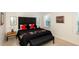 Bedroom with King size bed, bedside lamps, and neutral-toned walls at 3008 Secret Lake Dr, Kissimmee, FL 34747