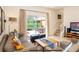 Bright living room with patio access, comfortable seating, and modern decor at 3008 Secret Lake Dr, Kissimmee, FL 34747