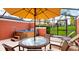 Patio featuring a hot tub, outdoor seating and loungers at 3008 Secret Lake Dr, Kissimmee, FL 34747