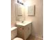 Bathroom featuring a toilet, sink, vanity with doors, mirror, and lighting at 3071 George Mason Ave # A, Winter Park, FL 32792