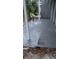 Concrete back patio area of home, with bare landscaping and close to window at 3071 George Mason Ave # A, Winter Park, FL 32792