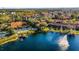 Aerial shot of a community featuring a lake, fountain, pool, and well-manicured grounds at 3154 Yellow Lantana Ln, Kissimmee, FL 34747