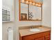 Bathroom featuring granite counters, updated sink, and shower at 3154 Yellow Lantana Ln, Kissimmee, FL 34747