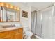 Bathroom with shower, updated sink, and granite counters at 3154 Yellow Lantana Ln, Kissimmee, FL 34747