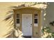 Charming home entrance featuring a decorative door, small windows, and well-maintained exterior at 3154 Yellow Lantana Ln, Kissimmee, FL 34747