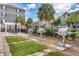 Community grilling area with multiple stainless steel grills and outdoor seating at 3154 Yellow Lantana Ln, Kissimmee, FL 34747