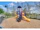 Community playground for residents features colorful equipment, slides, and a wood chip base at 3154 Yellow Lantana Ln, Kissimmee, FL 34747