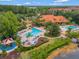 Aerial view of luxurious resort-style community pools, amenities, and lush landscaping at 3154 Yellow Lantana Ln, Kissimmee, FL 34747