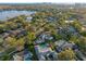 Neighborhood aerial view with lush greenery, showcasing the property's prime location near the lake and cityscape at 3308 Middlesex Rd, Orlando, FL 32803