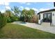 Spacious backyard with a refreshing pool, manicured lawn, and direct access to the house, ideal for outdoor enjoyment at 3308 Middlesex Rd, Orlando, FL 32803