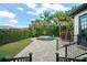 Beautiful backyard showcases a custom pool, lush landscaping, and seamless access to the house, creating a private oasis at 3308 Middlesex Rd, Orlando, FL 32803