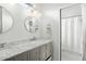 Stylish bathroom with a double vanity, marble countertop, and a shower at 3308 Middlesex Rd, Orlando, FL 32803
