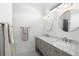 Elegant bathroom featuring a double vanity with marble countertop and modern fixtures at 3308 Middlesex Rd, Orlando, FL 32803