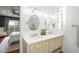 Bright bathroom featuring dual sinks, vanity with ample storage, and natural light at 3308 Middlesex Rd, Orlando, FL 32803