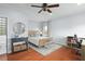 Cozy bedroom showcasing hardwood floors, a decorative rug, and ensuite bathroom at 3308 Middlesex Rd, Orlando, FL 32803