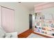Bright Bedroom with custom bookshelf and pink accents at 3308 Middlesex Rd, Orlando, FL 32803
