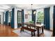 Bright dining room with hardwood floors, stylish decor, chandelier, and direct access to the backyard at 3308 Middlesex Rd, Orlando, FL 32803