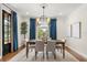 Dining room features a wooden table, six chairs, and natural lighting at 3308 Middlesex Rd, Orlando, FL 32803