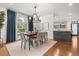 Dining room with modern decor and light fixture with an open view to the kitchen at 3308 Middlesex Rd, Orlando, FL 32803
