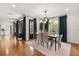Dining room with table and six chairs plus natural light from large windows at 3308 Middlesex Rd, Orlando, FL 32803