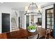 Inviting dining room showcases wood flooring, a stylish light fixture, and seamless transitions to the living spaces at 3308 Middlesex Rd, Orlando, FL 32803