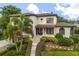 Beautiful two-story home with a tile roof, manicured landscaping, and an inviting walkway at 3308 Middlesex Rd, Orlando, FL 32803