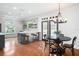Inviting kitchen with an island, stylish light fixture, and hardwood floors at 3308 Middlesex Rd, Orlando, FL 32803