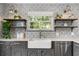 Charming kitchen with farmhouse sink, open shelving, and stylish wallpaper at 3308 Middlesex Rd, Orlando, FL 32803