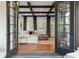 Living room with wooden floors and beams as seen from French doors at 3308 Middlesex Rd, Orlando, FL 32803