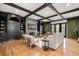 Bright living room boasts custom built-ins, a stone fireplace, beamed ceilings, hardwood floors, and stylish decor at 3308 Middlesex Rd, Orlando, FL 32803