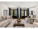 Inviting living room with stylish decor, comfortable seating, and elegant French doors to the outdoor space at 3308 Middlesex Rd, Orlando, FL 32803