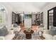 Bright sitting area with four chairs, French doors, and an open view to the rest of the home at 3308 Middlesex Rd, Orlando, FL 32803