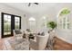 Inviting sitting area with arched windows, French doors, and comfortable seating arrangement at 3308 Middlesex Rd, Orlando, FL 32803