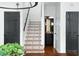 Staircase featuring decorative tile and black painted doors at 3308 Middlesex Rd, Orlando, FL 32803