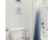 Clean bathroom with white tiled shower and blue ombre curtain at 4589 Boxwood Way, Mount Dora, FL 32757