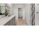 Bathroom featuring double sinks, shower, and walk-in closet at 4589 Boxwood Way, Mount Dora, FL 32757