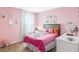 Bedroom featuring pink walls, white trim and a double bed at 4589 Boxwood Way, Mount Dora, FL 32757