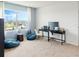 Bedroom with large window, blue beanbag chairs, and a black table desk at 4589 Boxwood Way, Mount Dora, FL 32757
