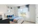 Bright bedroom with a large window and blue accents at 4589 Boxwood Way, Mount Dora, FL 32757