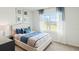 Serene bedroom with soft carpeting and a large window offering plenty of natural light at 4589 Boxwood Way, Mount Dora, FL 32757
