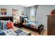 Bedroom featuring two twin beds, sporty decor, and a window at 4589 Boxwood Way, Mount Dora, FL 32757