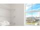 Linen closet featuring wire shelving and a view outside at 4589 Boxwood Way, Mount Dora, FL 32757
