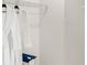 Walk-in closet with wire shelving and two white bathrobes at 4589 Boxwood Way, Mount Dora, FL 32757