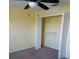 Bedroom with an open closet offering ample storage space, enhanced by neutral walls and carpet flooring at 5455 Vineland Rd # 3303, Orlando, FL 32811