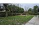A view of the green backyard with fencing at 5616 Clearview Dr, Orlando, FL 32819