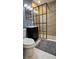 Modern bathroom with a glass-enclosed shower, sleek black vanity, and stylish fixtures at 5616 Clearview Dr, Orlando, FL 32819
