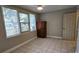 Neutral bedroom with closet, windows, and tile floors at 5616 Clearview Dr, Orlando, FL 32819