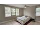 Sunlit bedroom with large windows, neutral decor, and tile flooring at 5616 Clearview Dr, Orlando, FL 32819